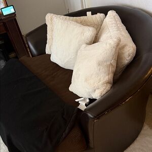 Brown Leather Sofa with Cream Cushions